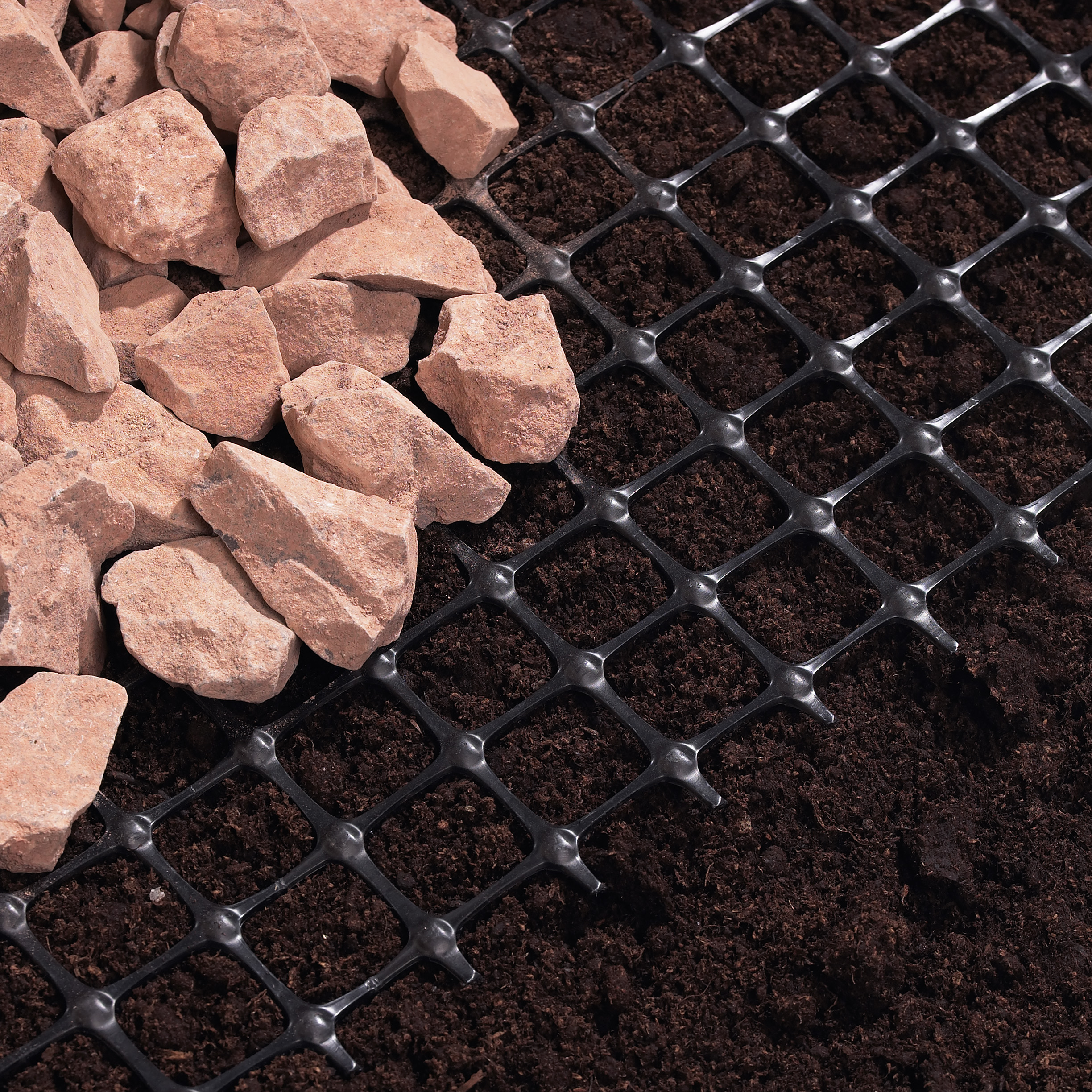 Geogrid over soil, with stones