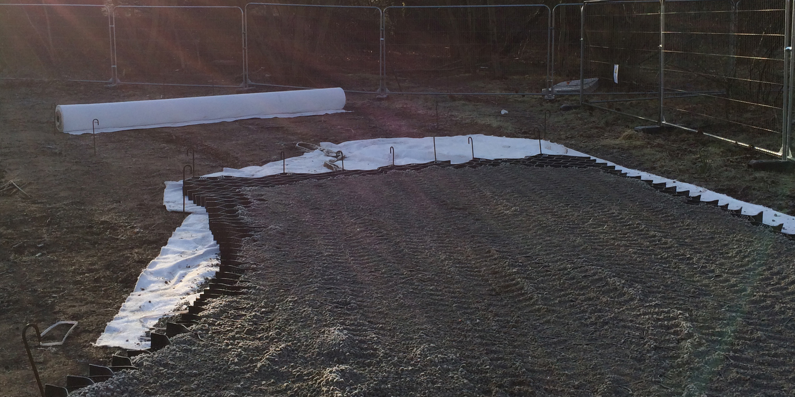 Pinned in place on top of MultiTrack nonwoven geotextile