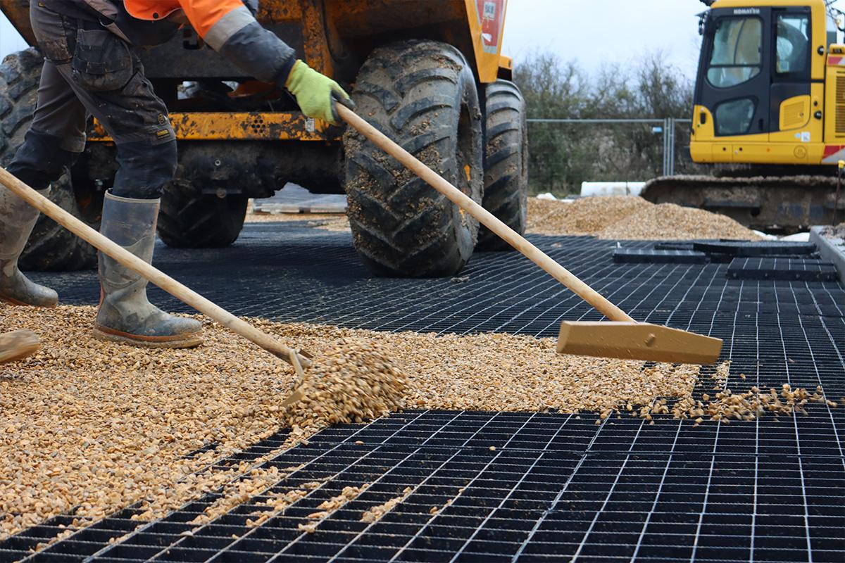 Raking stones over Ecodeck