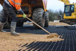 Ecodeck geopaving being installed with gravel infill