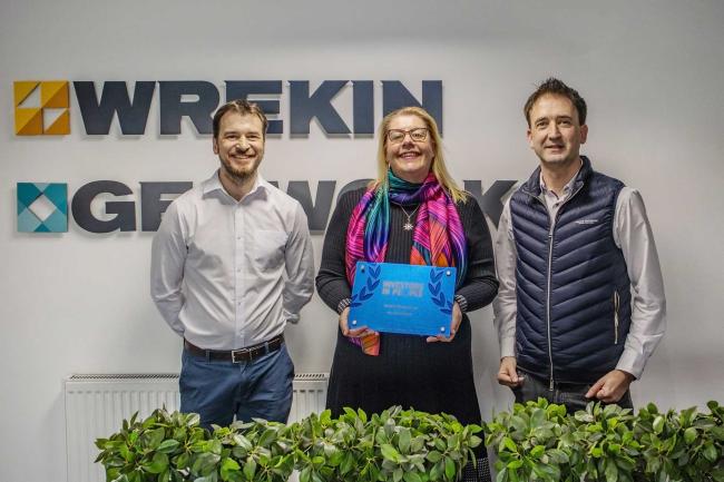 Paul McCabe, Mel Kinsey and Simon Turner hold the Investors In People plaque